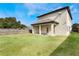 Large backyard with covered patio and grassy area at 675 Overspin Dr, Winter Park, FL 32789