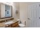 Simple bathroom with granite countertop, toilet and a single sink at 675 Overspin Dr, Winter Park, FL 32789