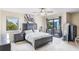 Spacious bedroom with a large bed, nightstands and plenty of natural light at 675 Overspin Dr, Winter Park, FL 32789