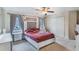 Cozy bedroom with a double bed, window, and built-in closet at 675 Overspin Dr, Winter Park, FL 32789