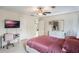 Well-lit bedroom with a double bed, private bathroom access and a desk at 675 Overspin Dr, Winter Park, FL 32789