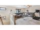 Upstairs bonus room with grey sectional sofa and treadmill at 675 Overspin Dr, Winter Park, FL 32789