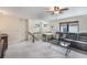 Multi-purpose bonus room featuring a sectional sofa and a dog crate at 675 Overspin Dr, Winter Park, FL 32789