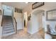 Bright entryway with tiled floors and staircase leading upstairs at 675 Overspin Dr, Winter Park, FL 32789