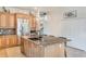 Island kitchen with granite countertops and stainless steel appliances at 675 Overspin Dr, Winter Park, FL 32789