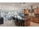 Spacious kitchen with island, stainless steel appliances, and wood cabinets at 675 Overspin Dr, Winter Park, FL 32789