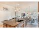 Open kitchen with large island and stainless steel appliances at 675 Overspin Dr, Winter Park, FL 32789