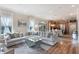 Spacious living room features a large sectional sofa and a view into the kitchen at 675 Overspin Dr, Winter Park, FL 32789
