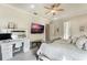 Main bedroom featuring a vanity, large bed and a fireplace at 675 Overspin Dr, Winter Park, FL 32789