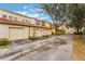 Townhome complex with three-car garage and driveway at 711 Centervale Dr # 711, Celebration, FL 34747