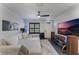 Spacious living room with sectional sofa, large TV, and aquarium at 711 Centervale Dr # 711, Celebration, FL 34747