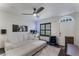 Spacious living room with sectional sofa, large TV, and aquarium at 711 Centervale Dr # 711, Celebration, FL 34747