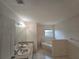 Bathroom with double sinks and a corner garden tub at 770 Mink Ct, Poinciana, FL 34759