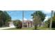 Charming single-story home with a lush front yard, complemented by tropical landscaping and a convenient two-car garage at 770 Mink Ct, Poinciana, FL 34759