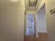 Clean hallway with wood flooring and access to other rooms at 770 Mink Ct, Poinciana, FL 34759