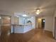 Kitchen features a breakfast bar and light-colored cabinets at 770 Mink Ct, Poinciana, FL 34759