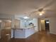 Kitchen boasting a breakfast bar and white cabinetry at 770 Mink Ct, Poinciana, FL 34759