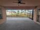 Expansive screened patio with a view of the landscaped backyard, perfect for outdoor entertaining and relaxation at 770 Mink Ct, Poinciana, FL 34759