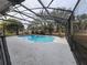 Inviting screened-in pool with clear blue water and ample patio space for lounging and entertaining at 770 Mink Ct, Poinciana, FL 34759