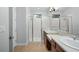 Spa-like bathroom with double sinks and a walk-in shower at 800 Ebb Tide Ln, Kissimmee, FL 34759
