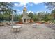 Relaxing patio with stone fireplace and seating at 800 Ebb Tide Ln, Kissimmee, FL 34759