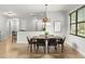 Open dining room features a stylish light fixture and lots of natural light at 800 Ebb Tide Ln, Kissimmee, FL 34759