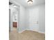 Bright entryway with tile flooring and access to a bathroom at 800 Ebb Tide Ln, Kissimmee, FL 34759