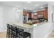 Granite kitchen island with breakfast bar and stainless steel appliances at 800 Ebb Tide Ln, Kissimmee, FL 34759