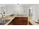 Granite countertops and wood cabinets highlight this eat-in kitchen at 800 Ebb Tide Ln, Kissimmee, FL 34759