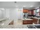 Open kitchen with granite counters, island, and stainless steel appliances at 800 Ebb Tide Ln, Kissimmee, FL 34759