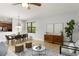 Well-lit living room showcasing an open layout with a dining area, perfect for entertaining and Gathering gatherings at 800 Ebb Tide Ln, Kissimmee, FL 34759