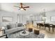 Spacious living room offers an open layout connecting to the dining area, perfect for modern living and entertaining at 800 Ebb Tide Ln, Kissimmee, FL 34759