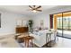 Bright living room featuring modern decor, ample seating, and sliding glass doors that lead to an outdoor space at 800 Ebb Tide Ln, Kissimmee, FL 34759