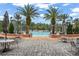 Resort-style pool with lounge chairs and patio tables at 800 Ebb Tide Ln, Kissimmee, FL 34759