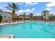 Inviting community pool with a large deck and building at 800 Ebb Tide Ln, Kissimmee, FL 34759