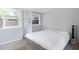 Bedroom with a white duvet cover and a window AC unit at 805 Wingo St, Orlando, FL 32803