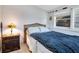 Small bedroom with blue bedding and a wooden nightstand at 805 Wingo St, Orlando, FL 32803