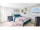 Bedroom with teal bedding and a gray dresser at 805 Wingo St, Orlando, FL 32803