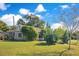 House with a manicured lawn and mature trees at 805 Wingo St, Orlando, FL 32803
