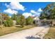 Charming house with a spacious yard, driveway, and lush landscaping at 805 Wingo St, Orlando, FL 32803