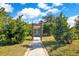Landscaped front yard with walkway leading to the home entrance at 805 Wingo St, Orlando, FL 32803