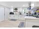 Modern white kitchen with ample cabinetry and counter space at 805 Wingo St, Orlando, FL 32803