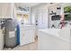 Convenient laundry room with washer, dryer, and storage at 805 Wingo St, Orlando, FL 32803