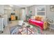 Cozy living room with mustard colored couch and patterned rug at 805 Wingo St, Orlando, FL 32803