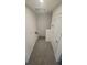 Hallway upstairs with a small storage nook and neutral carpet at 9088 Ocean Tide Way, Kissimmee, FL 34747