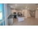 Modern kitchen featuring gray cabinets, stainless steel appliances, granite countertops, and an island at 9088 Ocean Tide Way, Kissimmee, FL 34747