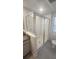 Modern bathroom with a glass-enclosed shower, granite-topped vanity, and a toilet at 9088 Ocean Tide Way, Kissimmee, FL 34747