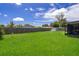 Large grassy backyard with shed and screened porch at 6655 Durango Ct, Orlando, FL 32809