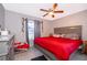 Main bedroom with king-size bed and red bedding at 6655 Durango Ct, Orlando, FL 32809