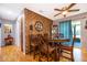 Dining room with wooden table and chairs, and wood-paneled feature wall at 6655 Durango Ct, Orlando, FL 32809